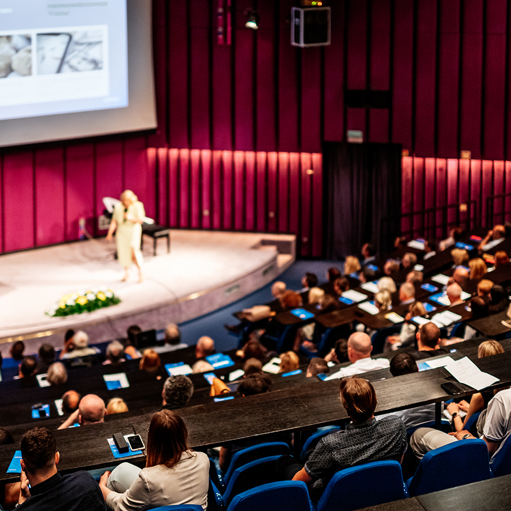 business-entrepreneurship-symposium-female-speaker-giving-talk-business-meeting-audience-conference-hall-rear-view-unrecognized-participant-audience business-entrepreneurship-symposium-female-speaker-giving-talk-business-meeting-audience-conference-hall-rear-view-unrecognized-participant-audience