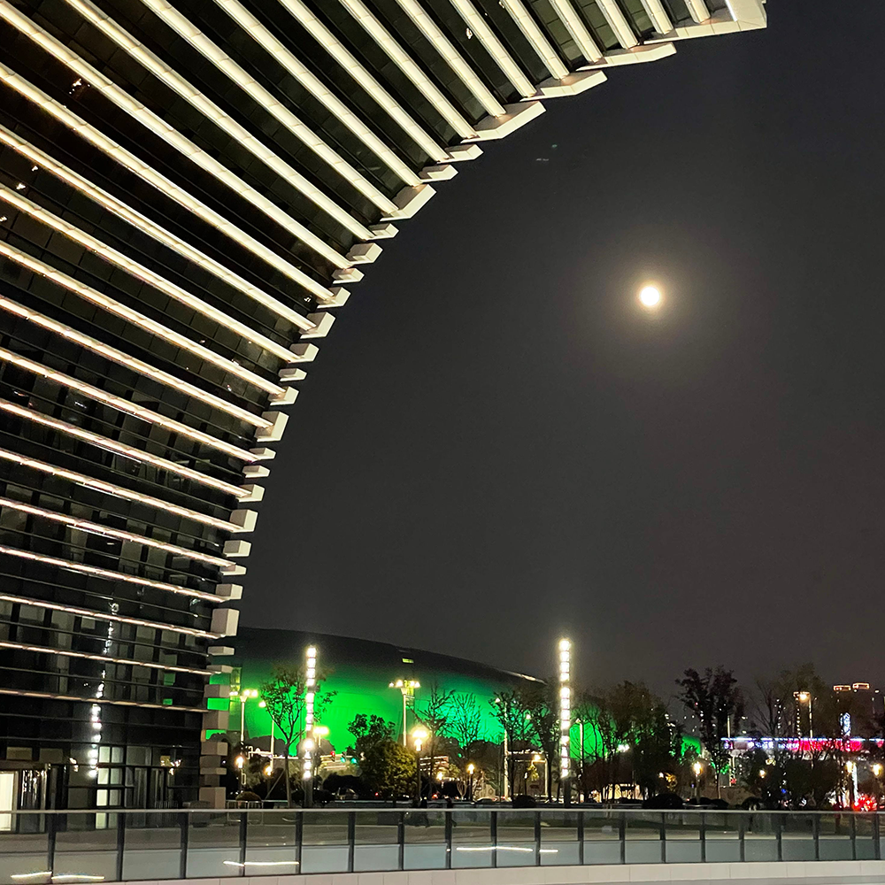 illuminated-culture-plaza-changzhou-china-with-full-moon-shining-sky-background illuminated-culture-plaza-changzhou-china-with-full-moon-shining-sky-background